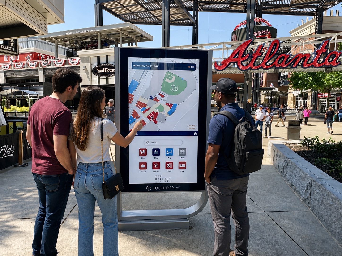 Guests using a Rove iQ wayfinding kiosk at The Battery Atlanta